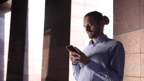 Man With Phone. Businessman Using Smartphone Outdoors