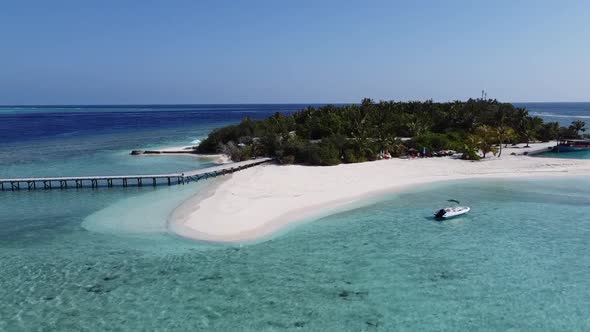 Aerial View of a Tropical Paradise Island Bay Covered in Limestone Trees with Crystal Clear Beach