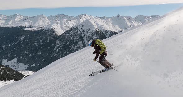 Cinematic downhill skiing in beautiful winter mountain landscape with high speed and fresh snow. Spo