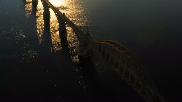 Sunset Aerial View Of Railroad Bridge