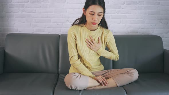 Young Female Suffering From Heartburn