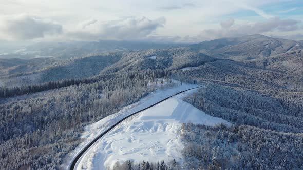 Aerial View on The Road and Forest in The Winter Time