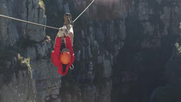 Young Caucasian man zip lining