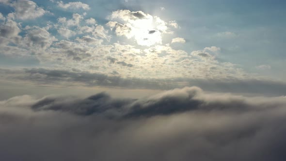 Fog morning at downtown district. Above the clouds.