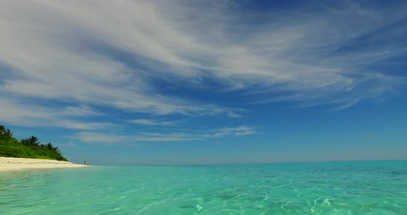 Tropical drone copy space shot of a white sandy paradise beach and turquoise sea background in hi re