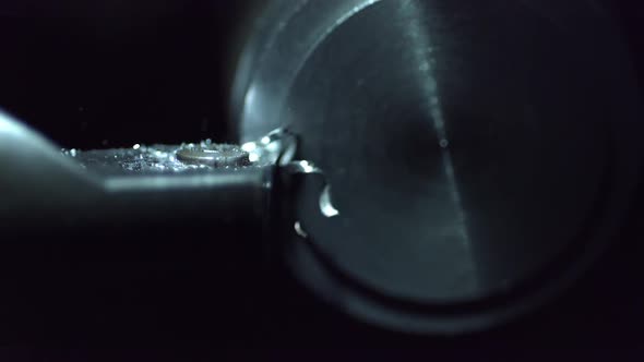 Slow motion of metal lathe carving metal