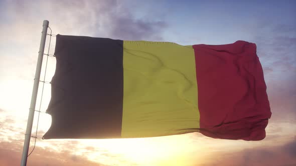 Flag of Belgium Waving in the Wind Sky and Sun Background