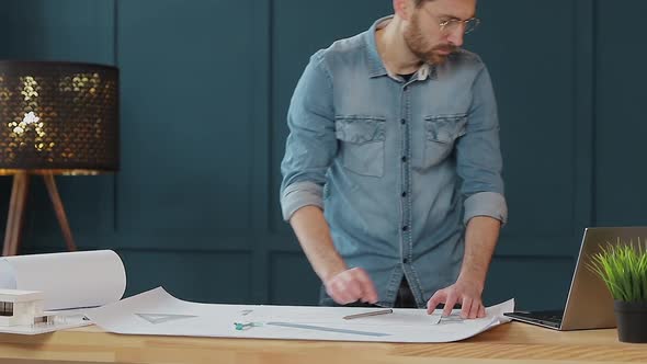 Architect Working on Blueprint with Spesial Tools and Pencil, Close Up. Male Architect at Work, Only