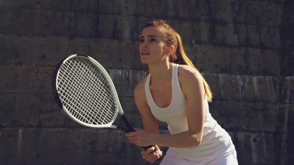 Woman playing tennis on a sunny day