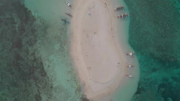 Cenital aerial drone view of famous naked island with white sand beach, turquousie surounding sea wa