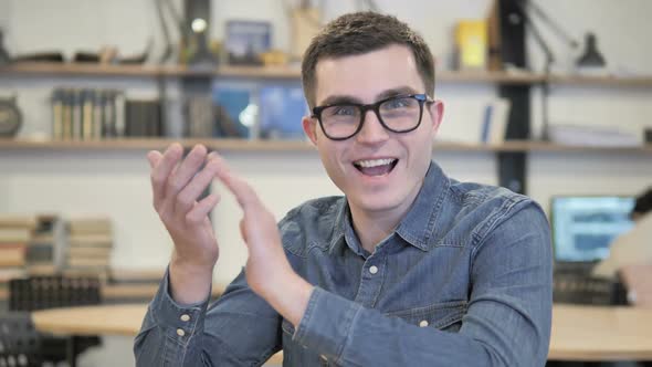 Man Clapping for His Team at Work Applauding