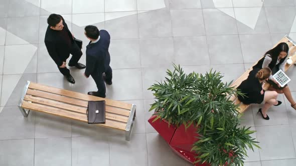 Business People Meeting In Lobby