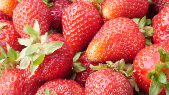 Juicy garden strawberry pile food and fruit background 4K 3840X2160 30fps UHD video - Red Fragaria a