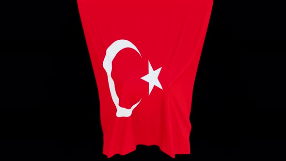 The piece of cloth falls with the flag of the State of Turkey to cover the product or item behind th