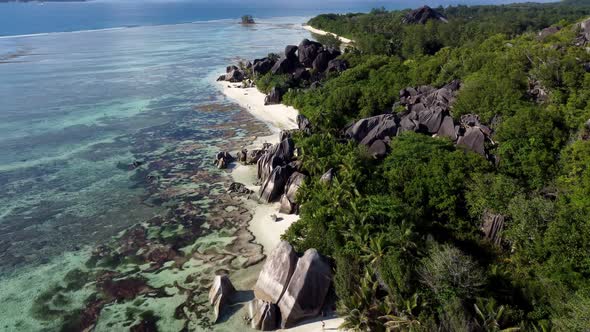 beach with large stones on the island of La Digue