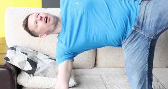 Young Man Falling on Sofa and Sleeping  Movie Slow Motion