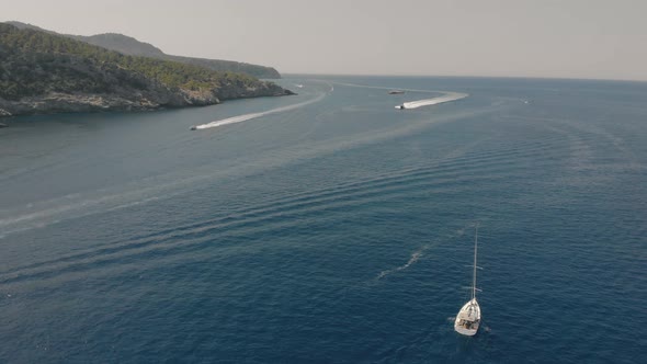 Aerial View of Yachts Near Rocky Island of Mallorca