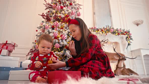 Video Portrait of Two Cute Little Children Eating Christmas Sweets