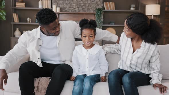 African Family Sit Down on Comfortable Couch in Living Room