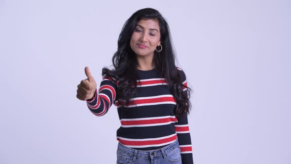 Happy Young Beautiful Persian Woman Giving Thumbs Up