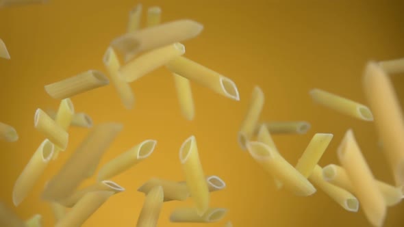 Raw Italian Pasta Penne Is Flying Up and Rotating on a Yellow Background