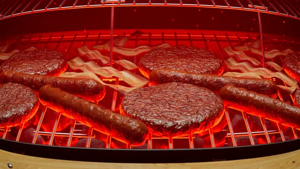 Grilling meat. Barbeque. Steaks, sausages, burgers. Grill with red hot charcoal.