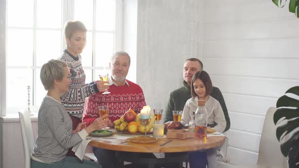 Happy Family Is Drinking Juice During the Party