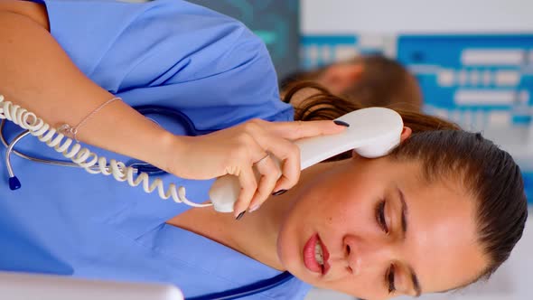 Vertical Video Medical Practitioner Answering Phone Calls