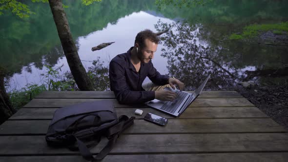 Businessman in the forest.