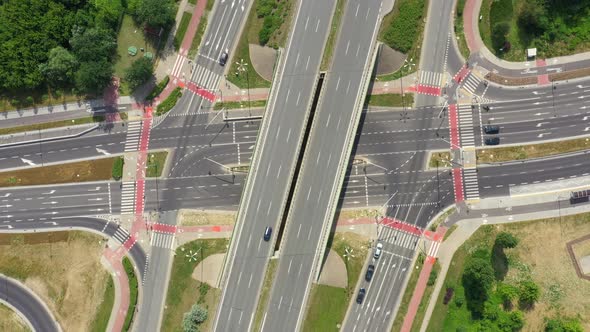 Highway aerial with cars and truck lorrying aerial view 4k. Four lane local road traffic transport v