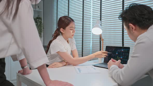 Group of Asian business broker trader advise about investment stock market and graph in office.