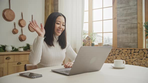 20s Young Woman on a Video Call Using Her Laptop in Her Apartment