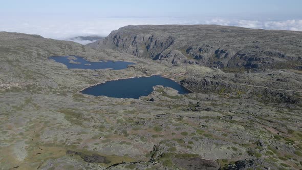 Aerial forward over Serra da Estrela with small lakes in background. Portugal