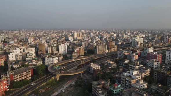 Flyover U Loop in Dhaka, Bangladesh. Urban Highway next to apartment buildings.