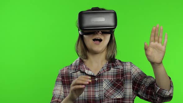 Young Woman Using VR Headset Helmet To Play Game. Watching Virtual Reality 3d 360 Video. Chroma Key