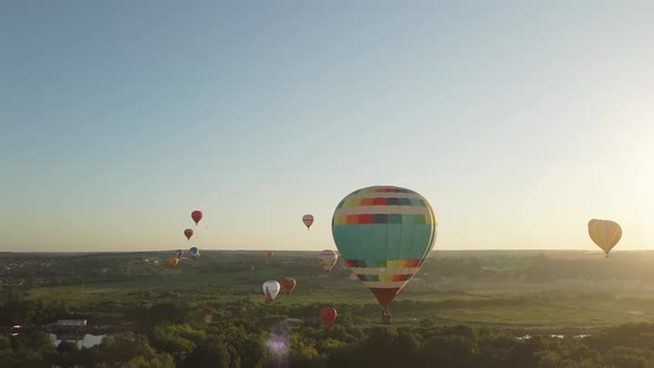Hot air balloons take off to the evening sky at festival