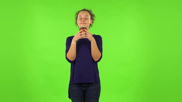 Curly Woman Enjoying Coffee . Green Screen