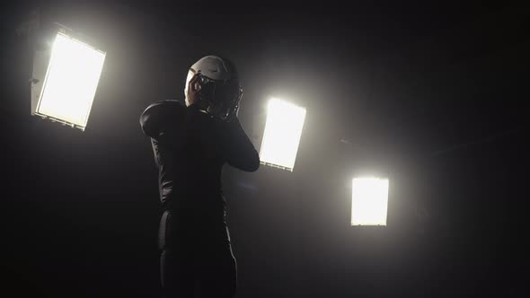 Portrait of a Bearded American Football Player Putting on Helmet and Preparing for Winning Game