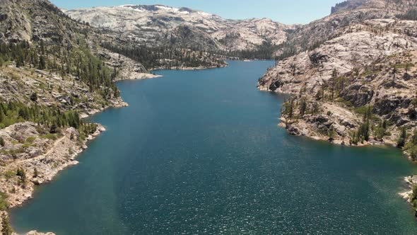 Expansive aerial view of a dam in California's Relief Reservoir near Kennedy Meadows.