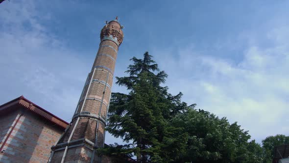 Mosque minaret decorated with Turkish tiles. Iznik tiles.