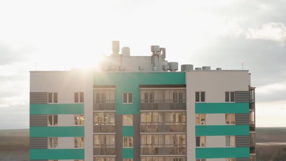 Aerial View of a Residential Building Against the Backdrop of an Urban Landscape