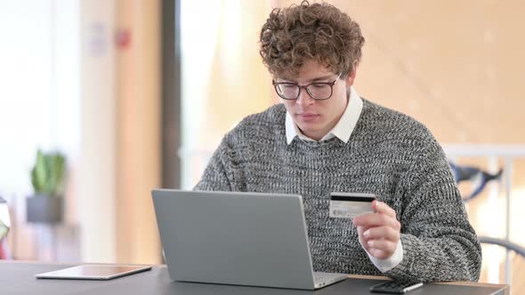 Online Shopping Success on Laptop By Young Man 