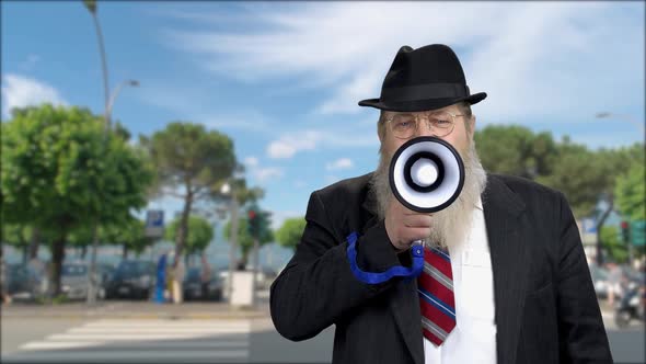 Confident Senior Man Speaking Through Megaphone