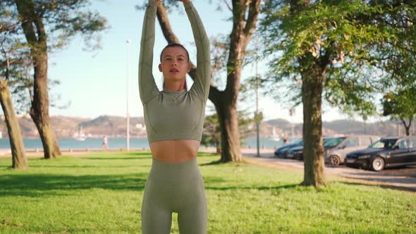 Woman Stretching And WarmingUp Before Running