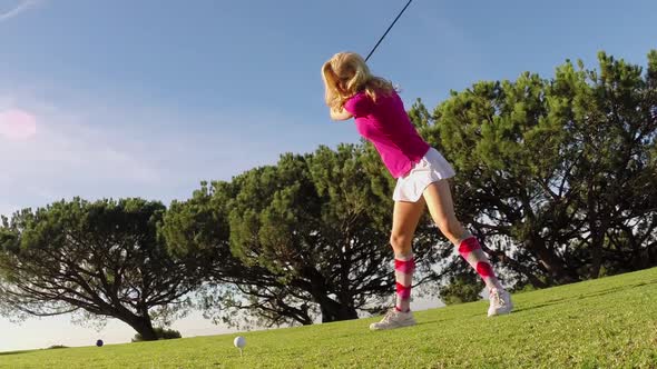 A woman playing golf