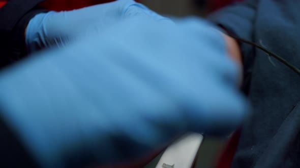 Medical Worker in Gloves Inserting Iv Fluids Into Patient Arm with Catheter