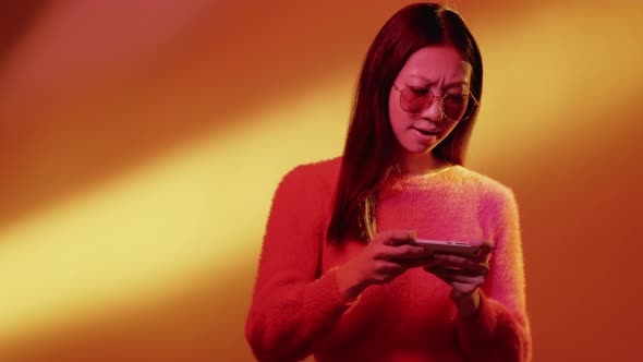 Mobile Gaming Color Light Girl Playing on Phone