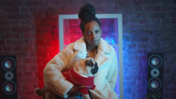 Portrait of African Woman Model in Stylish Clothes Posing on Camera with Cute Dog