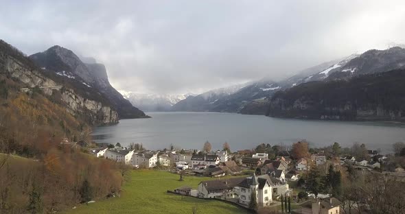 Beautiful fjord with a small village on the shore in Switzerland while winter.