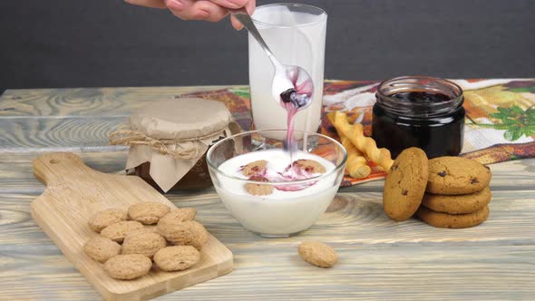 Breakfast. Cooking yogurt with berries and cookies